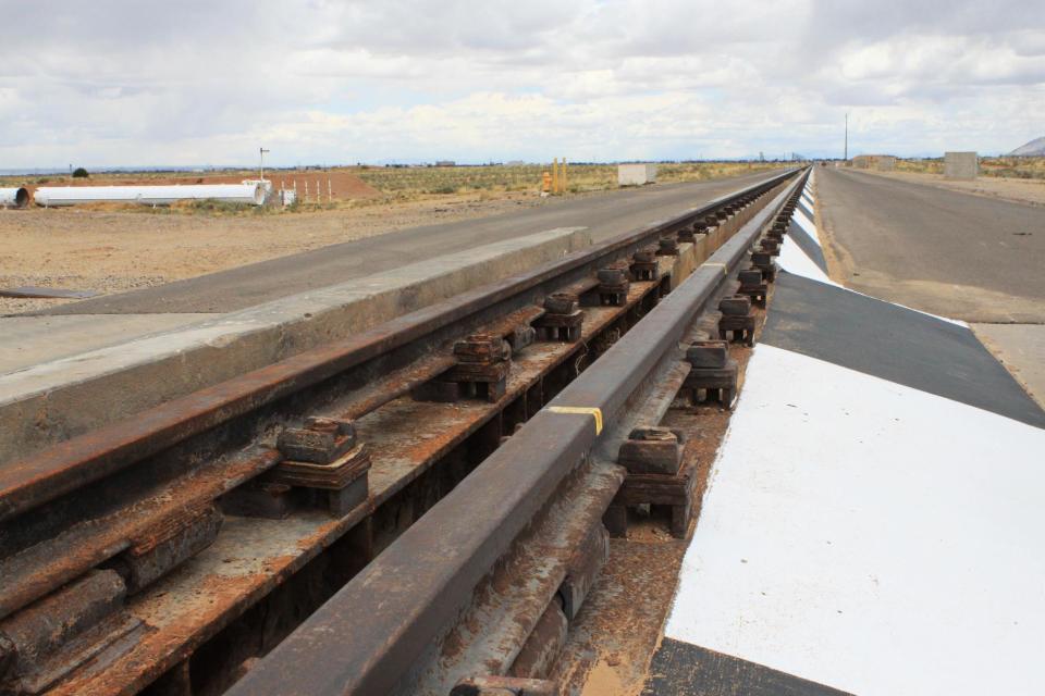 The 10,000-foot rocket sled track at Sandia National Laboratories sits idle during a tour of Sandia National Laboratories in Albuquerque, N.M., on Thursday, May 8, 2014. The track was recently renovated and officials say plans call for a series of tests on the track this summer. (AP Photo/Susan Montoya Bryan)