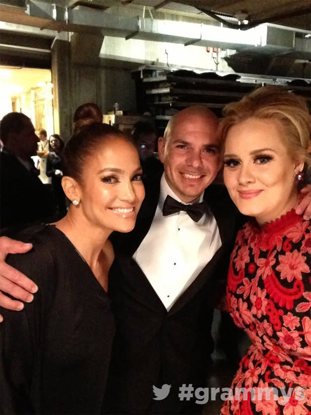 Backstage at the Grammys 2013: Adele posed for a photo with Jennifer Lopez and her boyfriend, Casper Smart backstage at the ceremony. Copyright [The Grammys]