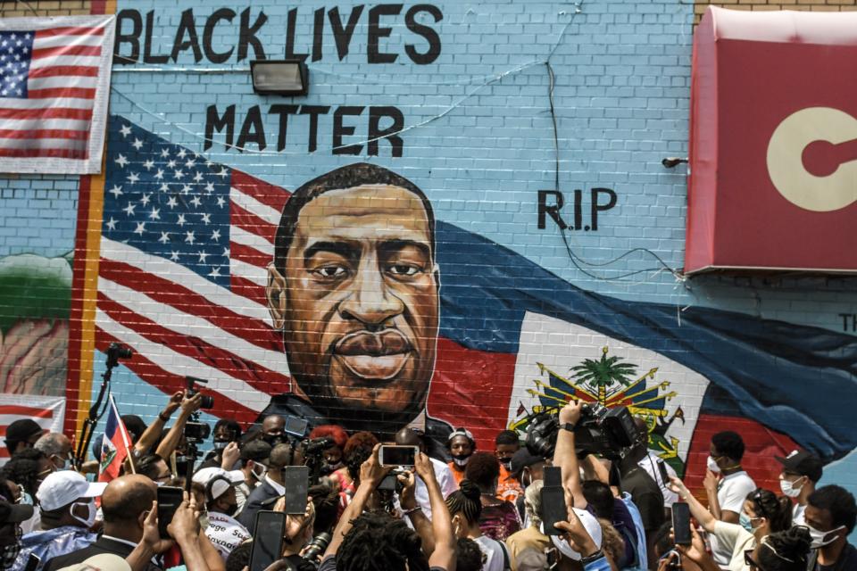 A mural painted by artist Kenny Altidor depicting George Floyd is unveiled on a sidewall of CTown Supermarket on 13 July, 2020 in the Brooklyn borough New York City.  Derek Chauvin has been sentenced to 22.5 years for Mr Floyd’s death. (Getty Images)