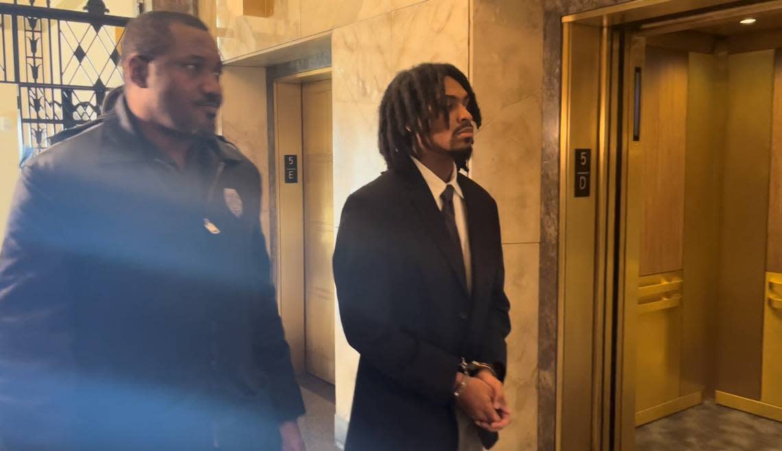 Ryson B. Ellis (right) is escorted to a courtroom at the Jackson County Circuit Court building in downtown Kansas City on Friday afternoon. Ellis pleaded guilty to the killing of LeGend Taliferro, 4, on June 29, 2020 and was sentenced to spend up to 22 years in Missouri prison.