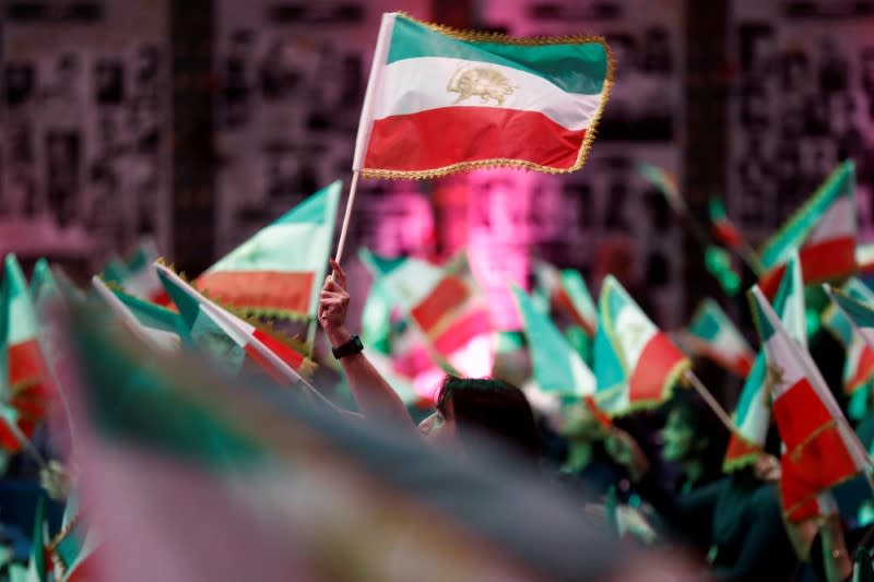 Attendees wave flags as Iranian Americans from across California converge in Los Angeles to participate in the California Convention for a Free Iran and to express support for nationwide protests in Iran