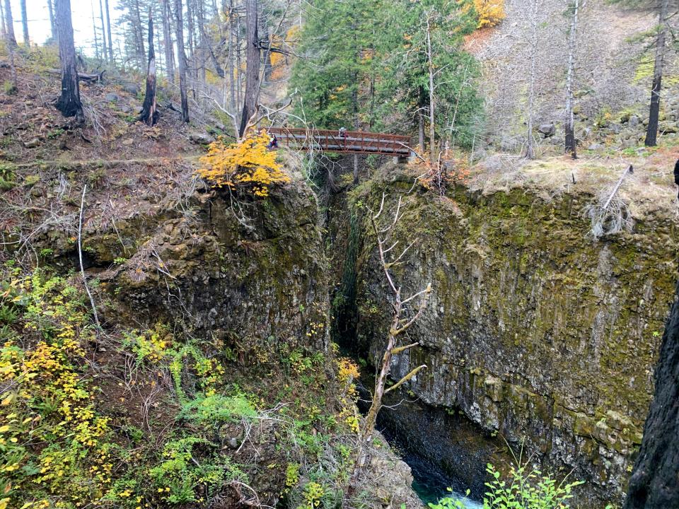 Eagle Creek Trail, in the Columbia River Gorge near Cascade Locks, features waterfalls, autumn colors and high bridges. The trail was the site of the 2017 Eagle Creek Fire, leaving burn scars throughout the hike.