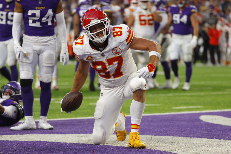 Kansas City Chiefs tight end Travis Kelce (87) celebrates after catching a 4-yard touchdown pass during the second half of an NFL football game against the Minnesota Vikings, Sunday, Oct. 8, 2023, in Minneapolis. (AP Photo/Bruce Kluckhohn)