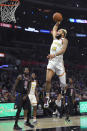 Golden State Warriors guard Ky Bowman goes up for a dunk as Los Angeles Clippers forward JaMychal Green, left, watches along with forward Kawhi Leonard, right, and forward Eric Paschall during the second half of an NBA basketball game Friday, Jan. 10, 2020, in Los Angeles. The Clippers won 109-100. (AP Photo/Mark J. Terrill)