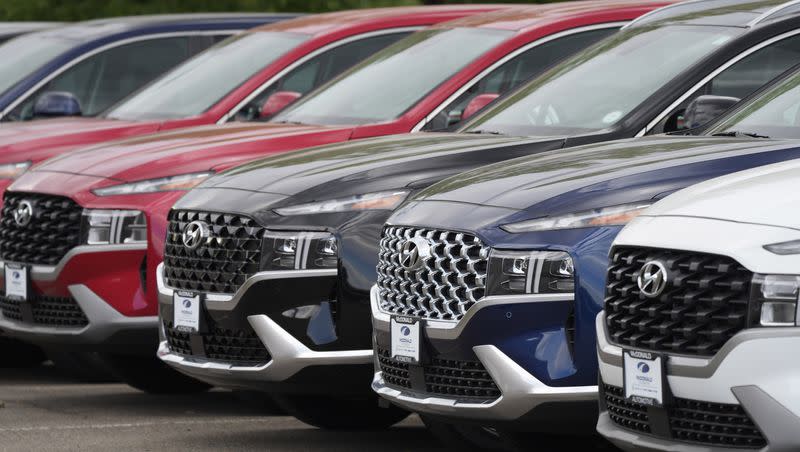 A line of 2022 Santa Fe SUVs sit outside a Hyundai dealership on Sept. 12, 2021, in Littleton, Colo. Nearly 3.4 million Hyundai and Kia vehicles in the U.S. are under recall due to the risk of engine compartment fires