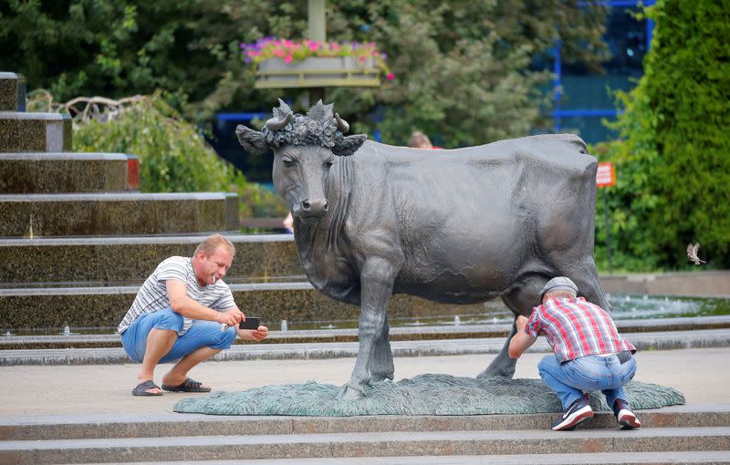 A man poses for a picture in Minsk
