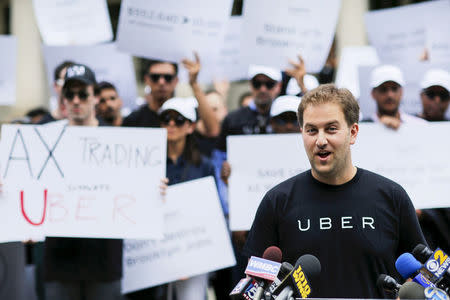 Josh Mohrer, Uber's general manager for New York, speaks to the media while Uber riders and driver-partners take part in a rally on steps of the New York City Hall in New York June 30, 2015. REUTERS/Eduardo Munoz/File Photo