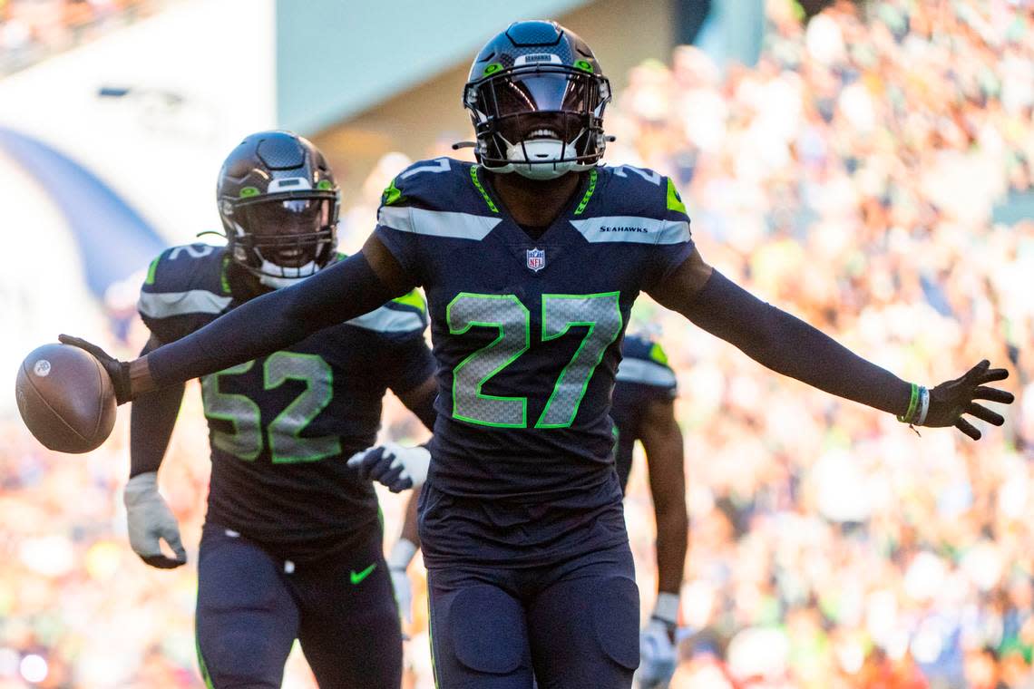 Seattle Seahawks cornerback Tariq Woolen (27) celebrates after recovering a fumble by Arizona Cardinals quarterback Kyler Murray (1) during the third quarter of an NFL game on Sunday, Oct. 16, 2022, at Lumen Field in Seattle.