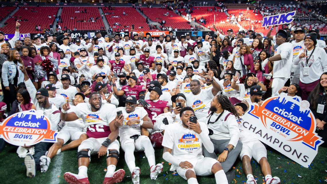 North Carolina Central gather for a group photo after the Celebration Bowl NCAA college football game against Jackson State, Saturday, Dec. 17, 2022, in Atlanta. (AP Photo/Hakim Wright Sr. )