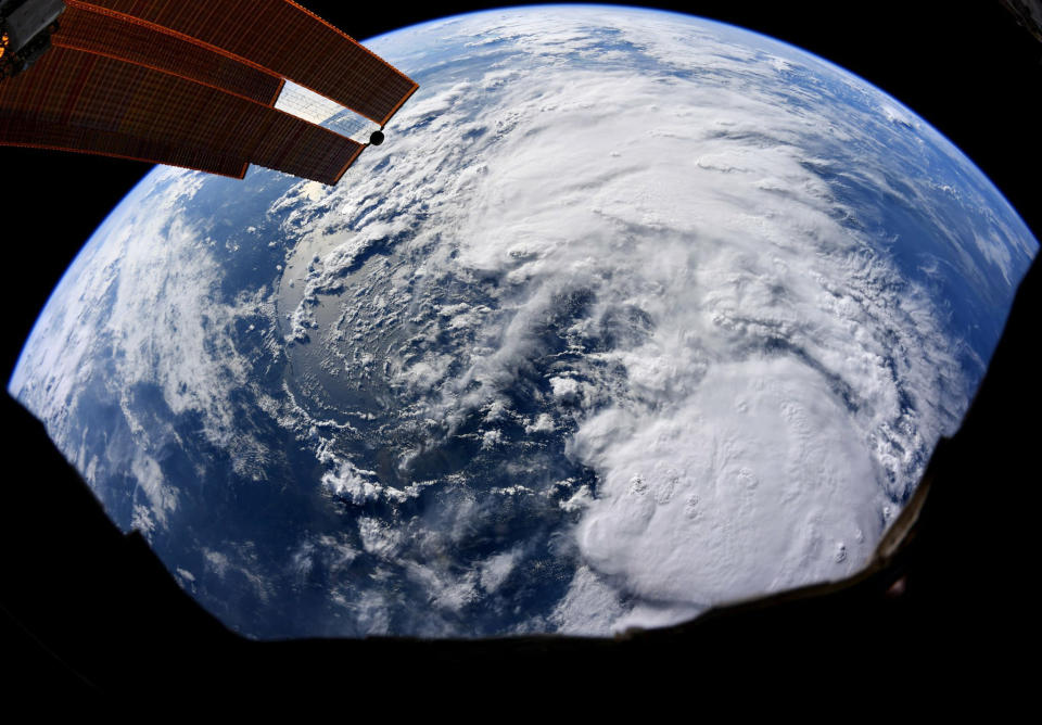 FILE - This file satellite image provided by NASA and taken by U.S. astronaut Christina Koch on Thursday, July 11, 2019 at the International Space Station, shows Tropical Storm Barry as it bears down on Texas, Louisiana, Alabama and the panhandle of Florida as it makes its way through the Gulf of Mexico. Barry could harm the Gulf Coast environment in a number of ways. But scientists say it’s hard to predict how severe the damage will be. (Christina Koch/NASA via AP, File)