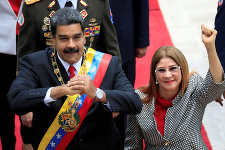 FILE PHOTO: Venezuela's President Nicolas Maduro and his wife Cilia Flores gesture during arrival for a special session of the National Constituent Assembly to take oath as re-elected President at the Palacio Federal Legislativo in Caracas, Venezuela May 24, 2018. REUTERS/Marco Bello/File Photo