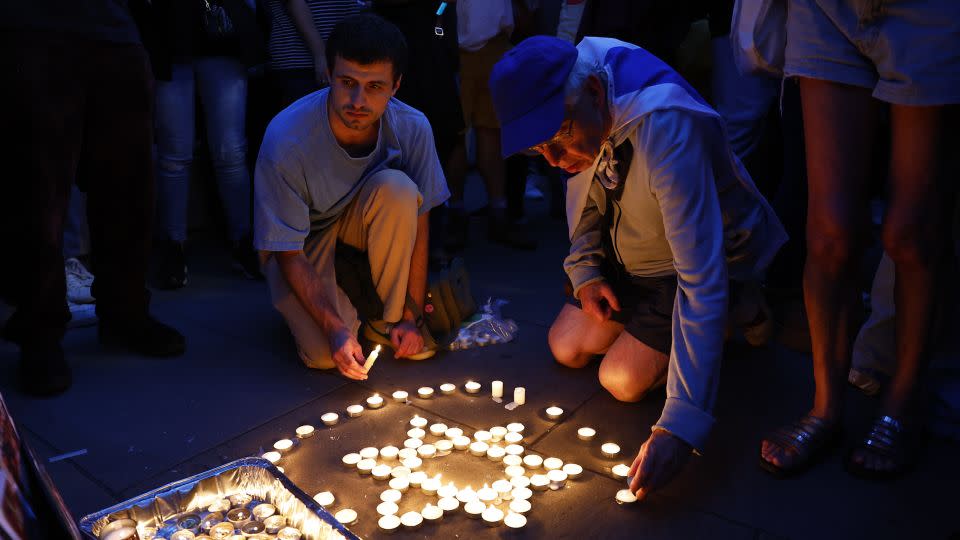 Members of the Jewish community light candles during a vigil for Israel at Downing Street in London on October 9. - Peter Nicholls/Getty Images