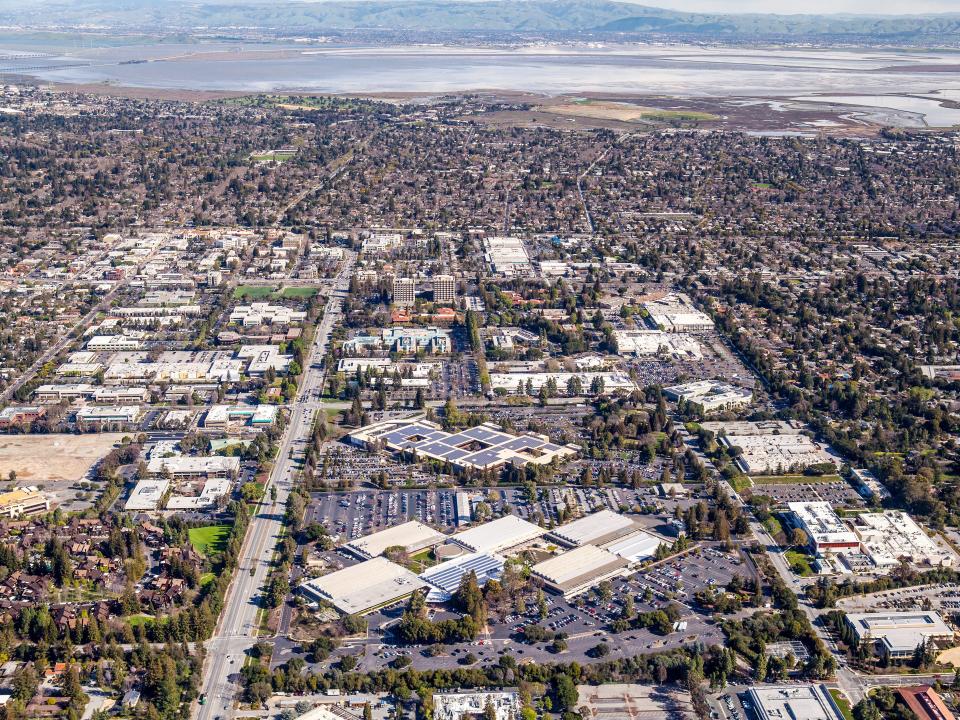 The Cities of Mountain View and Palo Alto, large company headquarters, with surrounding neighborhoods and the Oakland-Fremont area in the back of the frame.