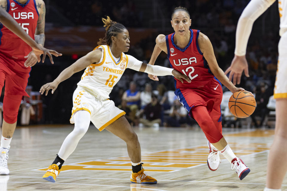 Team USA guard Diana Taurasi (12) drives against Tennessee guard Jasmine Powell (15) during the first half of an NCAA college basketball exhibition game, Sunday, Nov. 5, 2023, in Knoxville, Tenn. (AP Photo/Wade Payne)