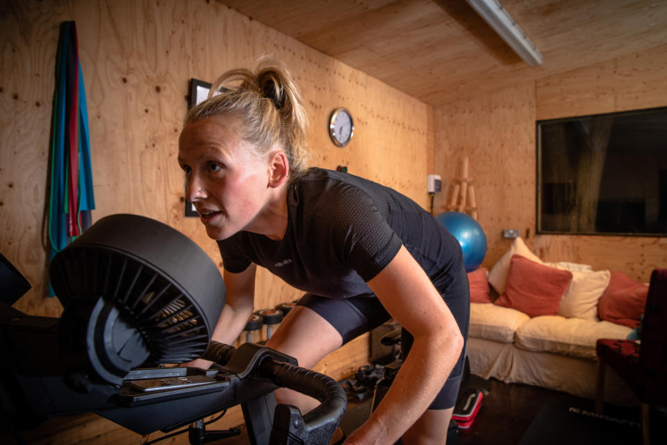 Image shows rider exercising indoors.