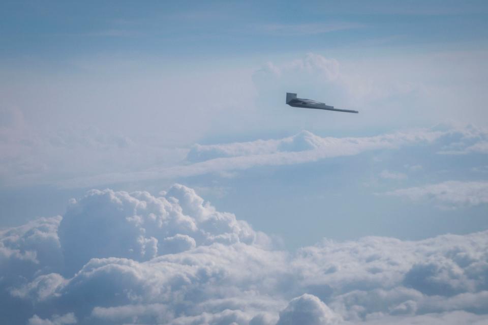 B-2 Spirit flies alongside a KC-46A Pegasus during RED FLAG-Alaska 23-3 over the Joint Pacific-Alaska Range Complex, Alaska, August 15, 2023. <em>U.S. Air Force photo by Airman 1st Class Andrew Britten</em>