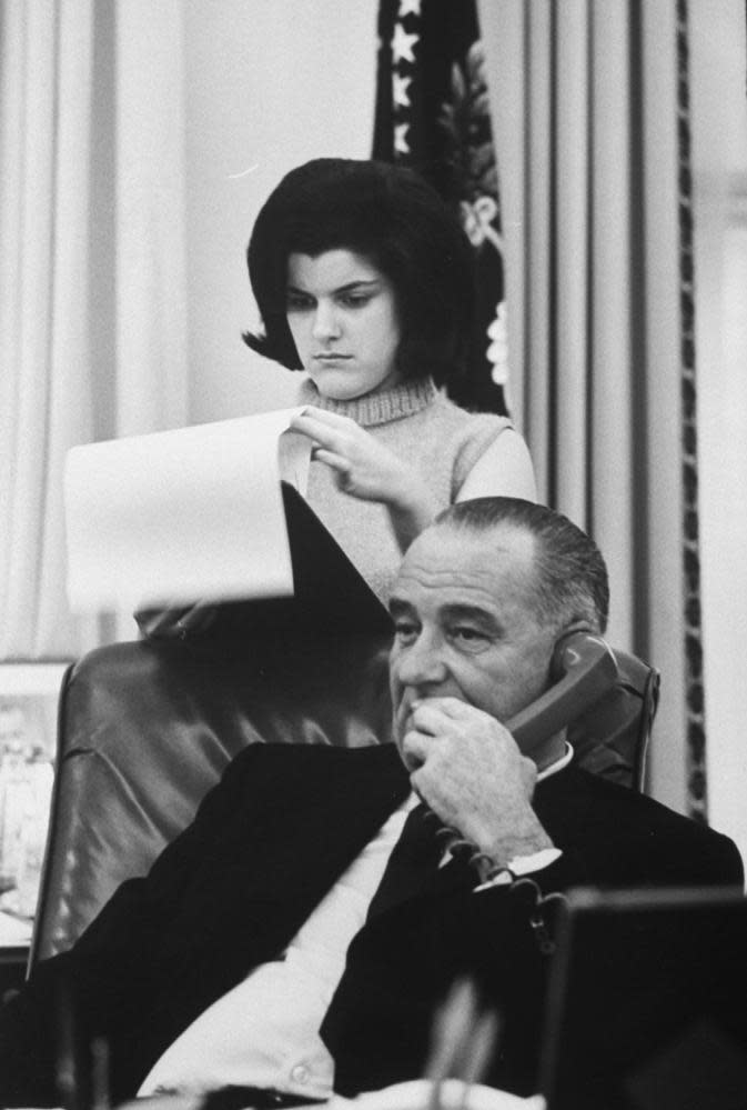 Lyndon Johnson with his daughter Luci in the White House.