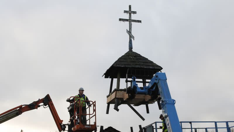 The bell tower at the old St. Nicholas Orthodox Church in Eklutna, Alaska, is shown being removed Oct. 13, 2023.