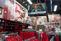 A television is tuned to the Big Ten network as Nebraska merchandise is offered for sale at the Husker Hounds store in Omaha, Neb., Wednesday, Aug. 12, 2020. The Big Ten conference announced on Tuesday, Aug. 11, 2020, they won't play football this fall because of concerns about COVID-19, becoming the first of college sports' power conferences to yield to the pandemic. (AP Photo/Nati Harnik)