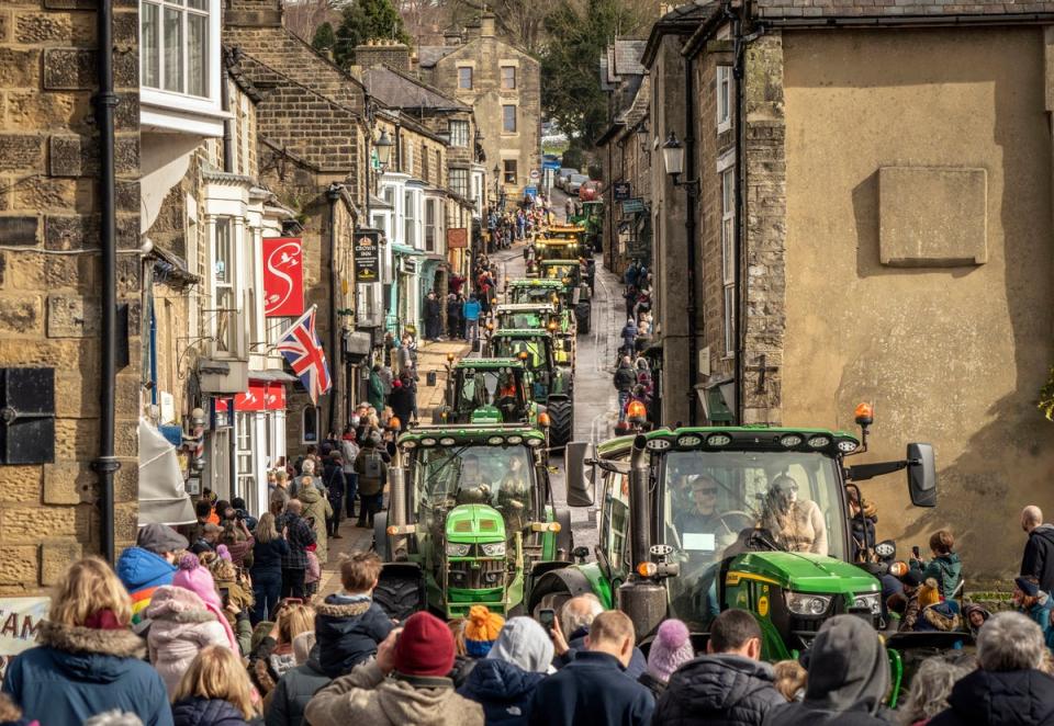 12 March 2023: A convoy of 374 Tractors make their way through Pateley Bridge in North Yorkshire during the Knaresborough Tractor Run (PA)