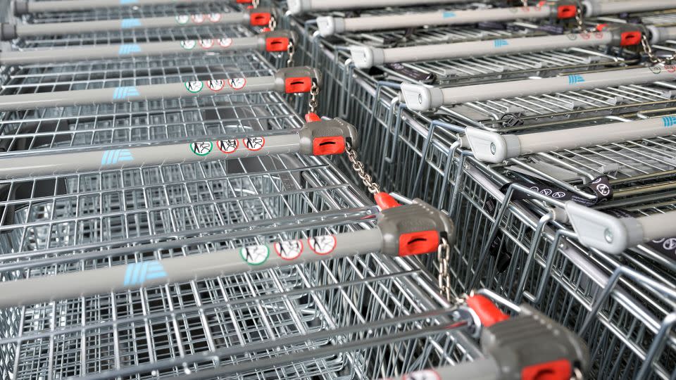 Shopping carts at the Aldi store on July 22, 2022 in Tarleton, United Kingdom. The carts are released by inserting a coin that is later refunded. - Christopher Furlong/Getty Images