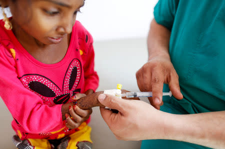 Afaf Hussein, 10, who is malnourished, receives an injection at the malnutrition treatment ward of al-Sabeen hospital in Sanaa, Yemen, February 3, 2019. REUTERS/Khaled Abdullah