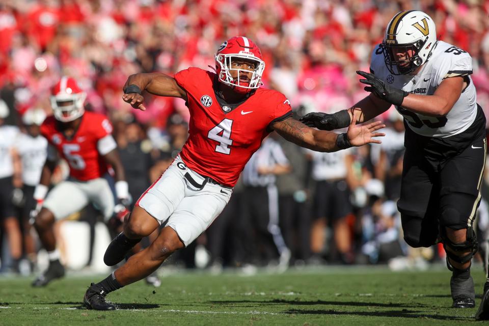 FILE - Georgia linebacker Nolan Smith (4) rushes the passer in the first half of a NCAA college football game against Vanderbilt Saturday, Oct. 15, 2022 in Athens, Ga.