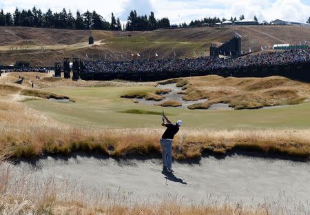 Jun 19, 2015; University Place, WA, USA; Jordan Spieth hits out of a bunker on the 18th hole in the second round of the 2015 U.S. Open golf tournament at Chambers Bay. Mandatory Credit: Michael Madrid-USA TODAY Sports / Reuters Picture Supplied by Action Images