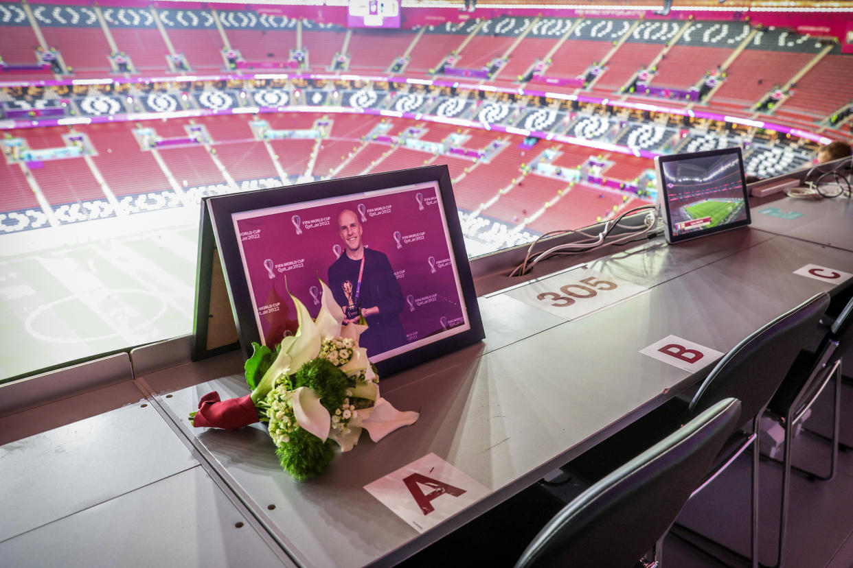Image: Flowers are placed in memory of Grant Wahl prior to the FIFA World Cup Qatar 2022 quarter final match between England and France at Al Bayt Stadium on Dec. 10, 2022 in Al Khor, Qatar. (Clive Brunskill / Getty Images)