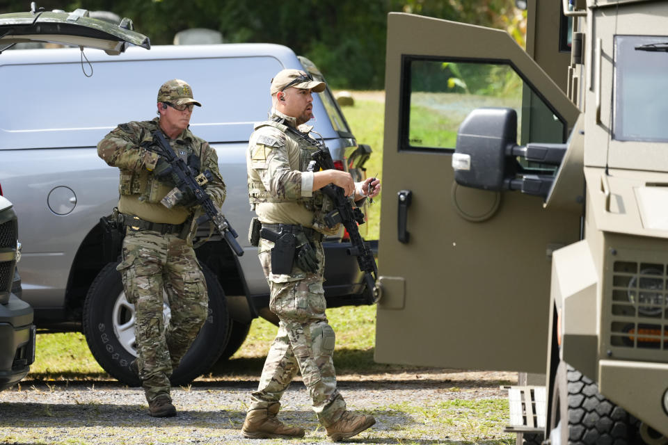 Law enforcement officers gather as they search for escaped convict Danelo Cavalcante in Glenmoore, Pa., Monday, Sept. 11, 2023. (AP Photo/Matt Rourke)