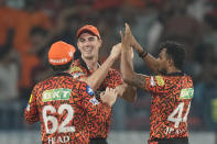 Sunrisers Hyderabad's captain Pat Cummins, centre, celebrates the runout of Lucknow Super Giants' Krunal Pandya with his teammates during the Indian Premier League cricket match between Sunrisers Hyderabad and Lucknow Super Giants in Hyderabad, India, Wednesday, May 8, 2024. (AP Photo/Mahesh Kumar A.)