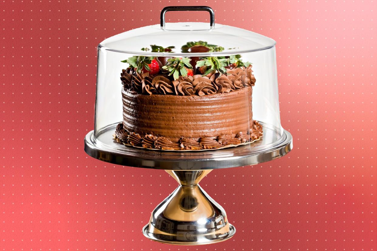 chocolate cake in a cake dome
