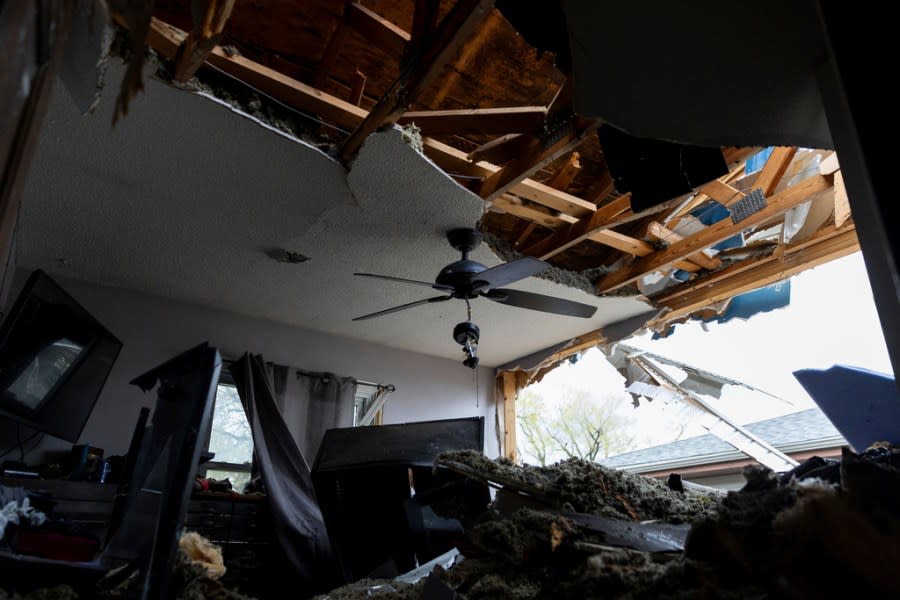 Damage is seen to Justin and Amanda Putnam’s bedroom after a severe storm damaged their neighborhood in Council Bluffs, Iowa, on Friday, April 26, 2024. (Anna Reed/Omaha World-Herald via AP)