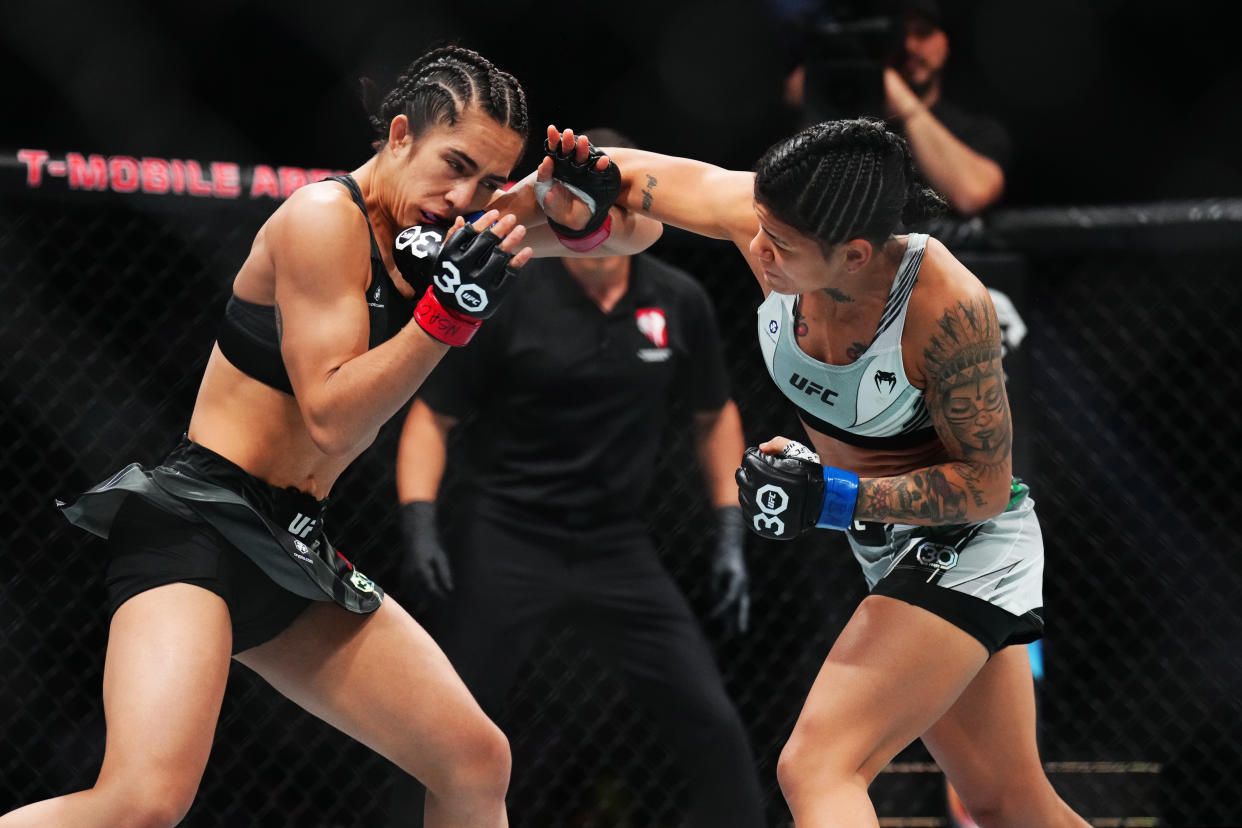 Denise Gomes (right) punches Yazmin Jauregui in a strawweight fight during the UFC 290 event at T-Mobile Arena on July 08, 2023 in Las Vegas, Nevada. (Photo by Chris Unger/Zuffa LLC via Getty Images)