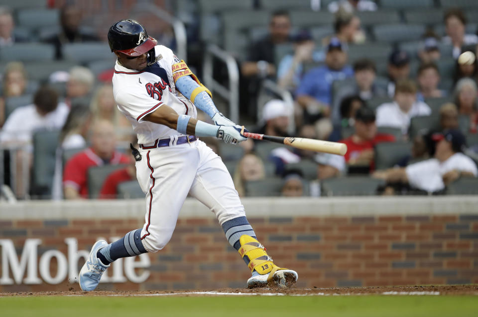 Atlanta Braves' Ronald Acuna Jr. swings for a home run off St. Louis Cardinals pitcher Kwang Hyun Kim in the third inning of the second baseball game of a doubleheader on Sunday, June 20, 2021, in Atlanta. (AP Photo/Ben Margot)