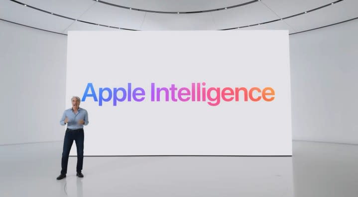 Craig in front of a screen reading Apple Intelligence