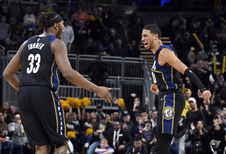 Indiana Pacers guard Tyrese Haliburton (0) reacts after making a 3-point basket during the second half of an NBA basketball game against the Toronto Raptors, Saturday, Nov. 12, 2022, in Indianapolis, Ind. (AP Photo/Marc Lebryk)