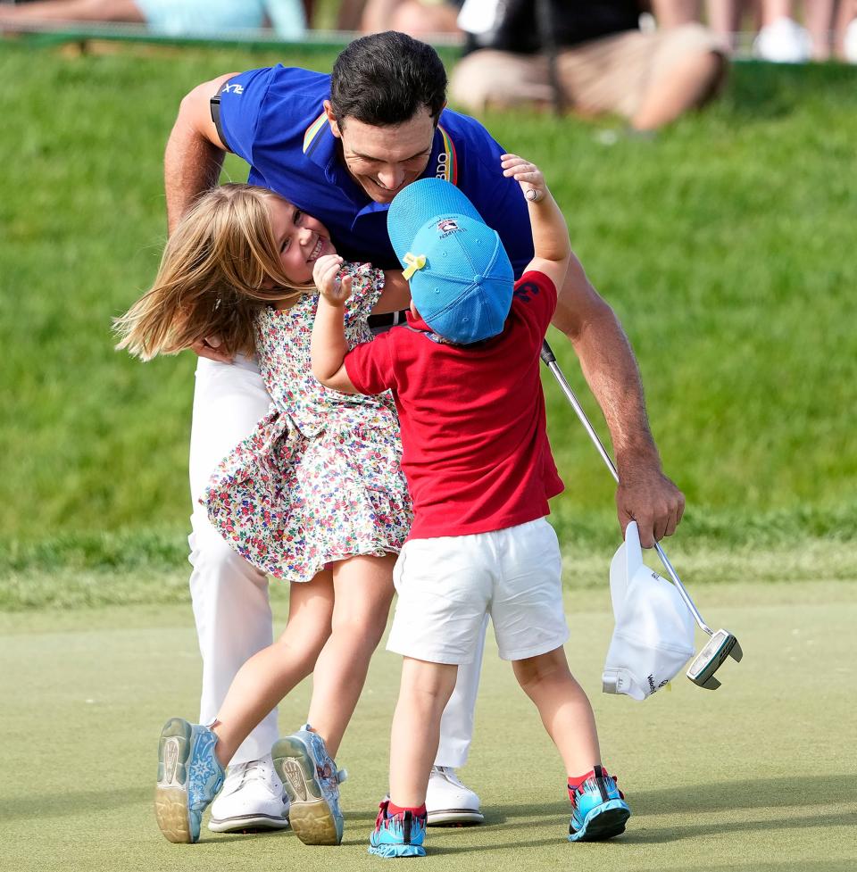 Billy Horschel hugs his daughter Colbie and son Axel after winning the Memorial Tournament on Sunday.