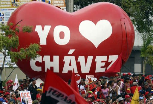 Supporters of Venezuelan President Hugo Chavez attend a massive rally after he registered his candidacy in the National Electoral Center for the upcoming presidential election, in Caracas on June 11, 2012