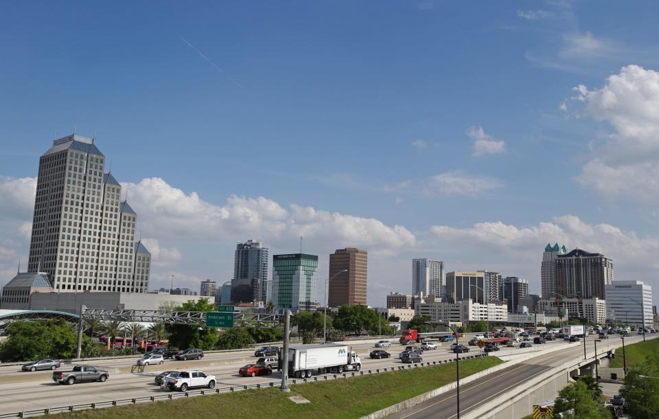 Traffic moves along Interstate 4 past the downtown area of Orlando, Florida.