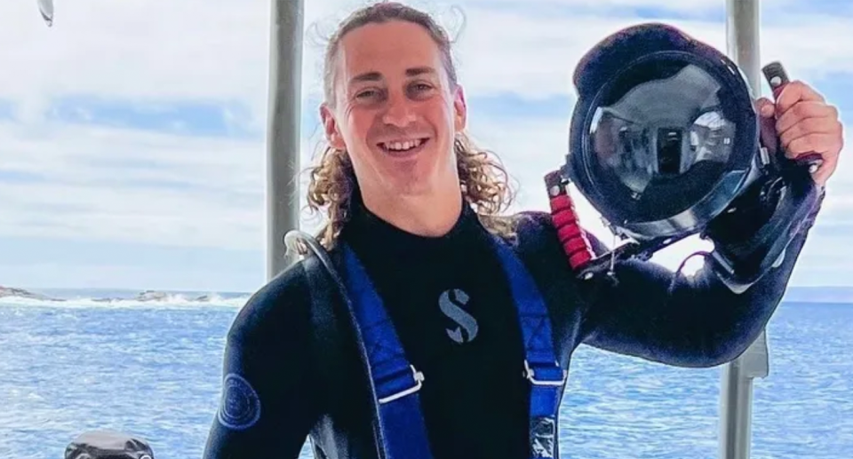 Canadian national Ambrose Walton in a diving wetsuit.