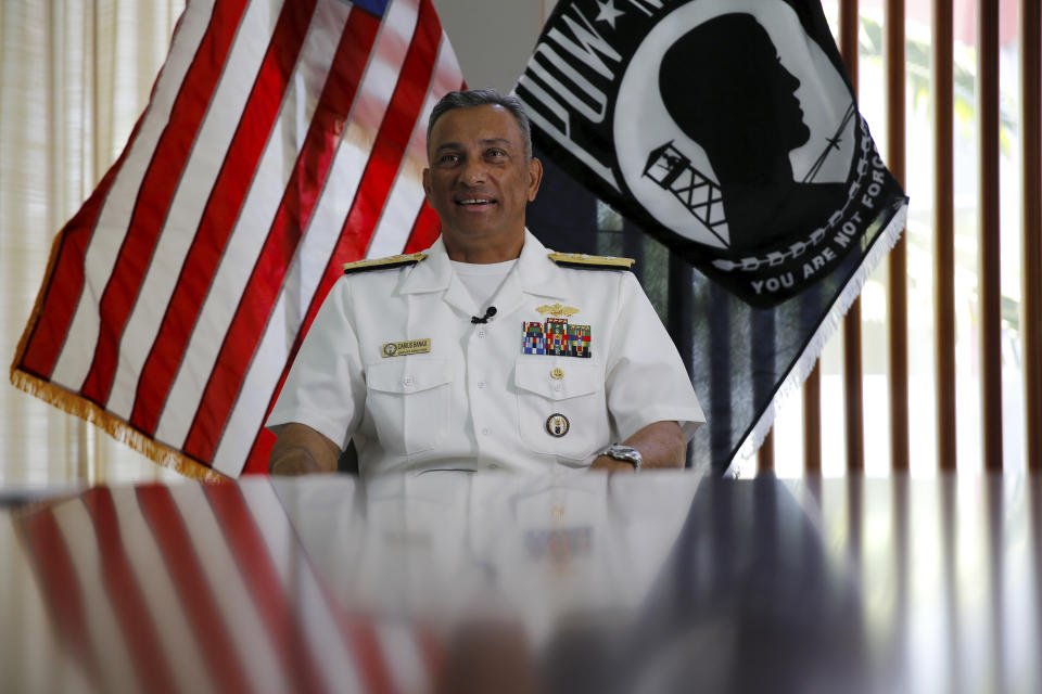 U.S. Navy Rear Adm. Darius Banaji, the Defense POW/MIA Accounting Agency's deputy director, talks with The Associated Press at Hawaii's Joint Base Pearl Harbor-Hickam on Thursday, July 15, 2021. Advances in DNA technology have allowed the U.S. military to exhume and identify the remains of hundreds of sailors and Marines buried as unknowns from the bombing of Pearl Harbor, decades after the 1941 attack that launched the U.S. into World War II. But the Defense POW/MIA Accounting Agency, which is responsible for locating and identifying missing servicemen and women, says it won't be able to do the same for those from the battleship that lost the most men that day: the USS Arizona. (AP Photo/Caleb Jones)