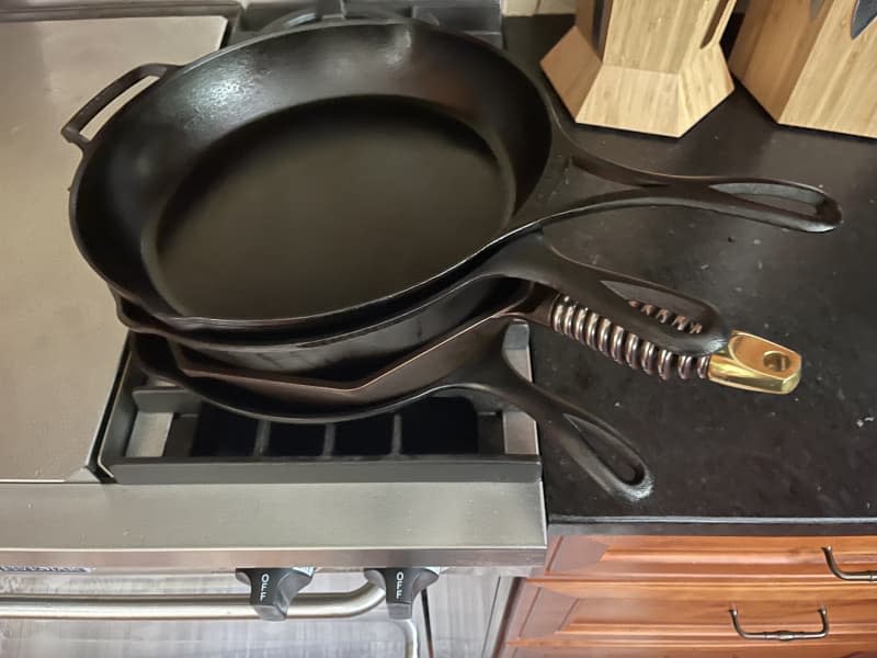 stack of cast iron skillets