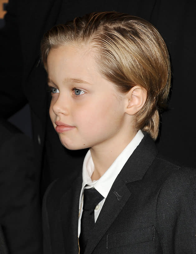 Brad Pitt with Shiloh, Pax and Maddox on the red carpet.