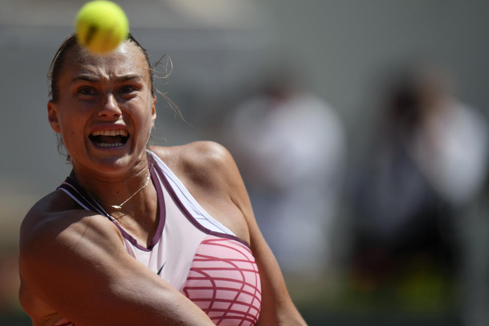 Aryna Sabalenka of Belarus eyes the ball as she plays a shot against Russia's Kamilla Rakhimova during their third round match of the French Open tennis tournament at the Roland Garros stadium in Paris, Friday, June 2, 2023. (AP Photo/Thibault Camus)