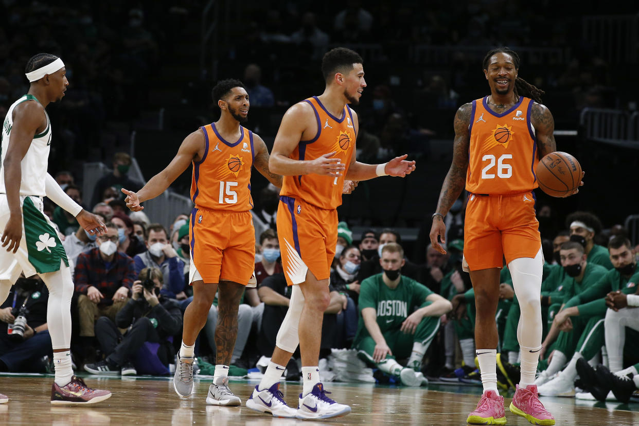 Dec 31, 2021; Boston, Massachusetts, USA; Phoenix Suns guard Cameron Payne (15), guard Devin Booker (1) and Emanuel Terry (26) react to a call against them during the second half against the Boston Celtics at TD Garden. Mandatory Credit: Winslow Townson-USA TODAY Sports