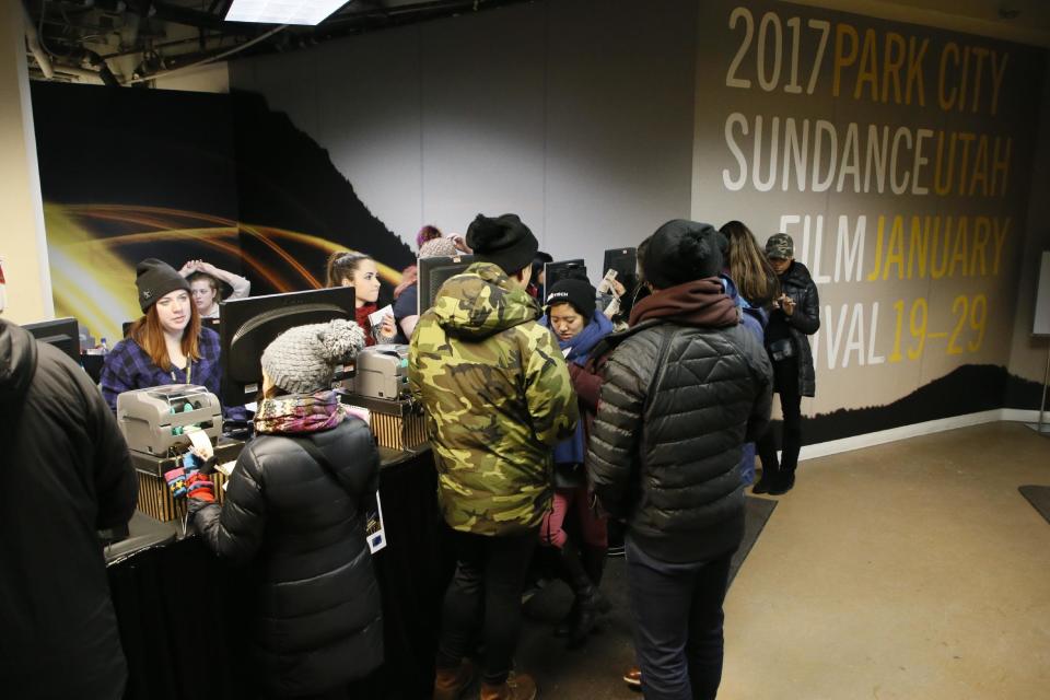 Festival goers visit the Festival Box Office during the 2017 Sundance Film Festival on Saturday, Jan. 21, 2017, in Park City, Utah. Representatives for the Sundance Film Festival say that their network systems were subject to a cyberattack that caused its box offices to shut down briefly Saturday afternoon. (Photo by Danny Moloshok/Invision/AP)