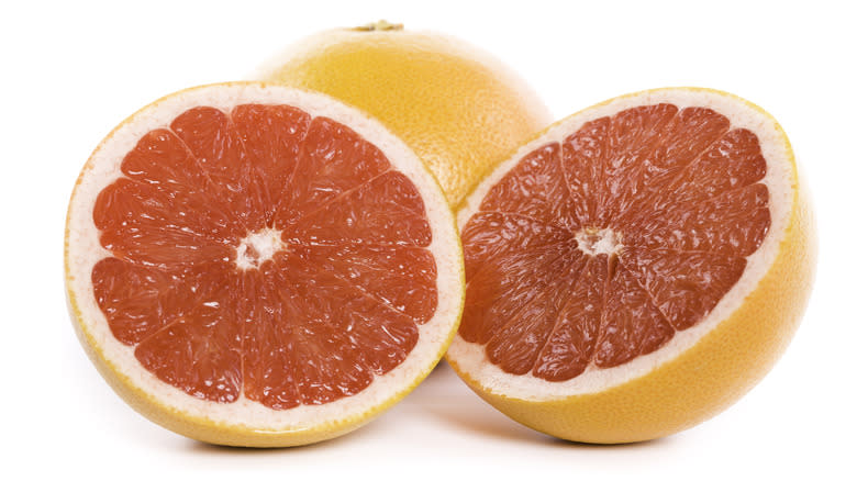 Sliced grapefruit on white background 