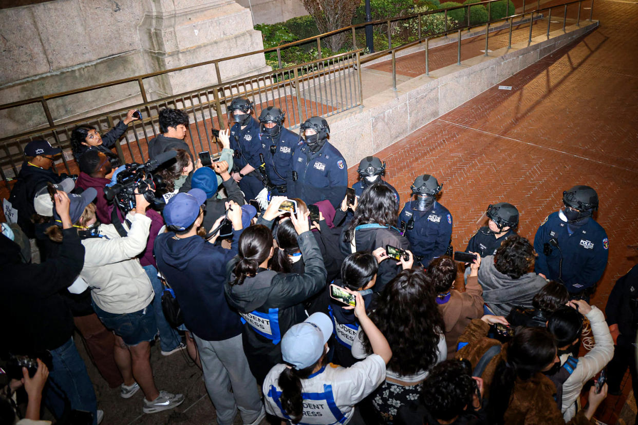 NYPD officers in riot gear enter Columbia University's encampment. (Julia Wu / AFP - Getty Images)