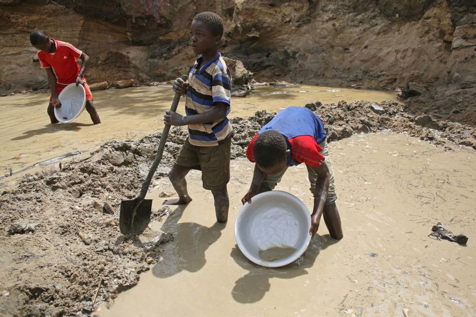 Boys pan for gold and diamonds near the town of Gaga